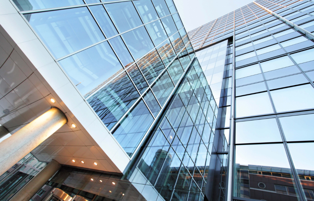 Modern building with energy-efficient architectural glass panels reducing heat and energy use.