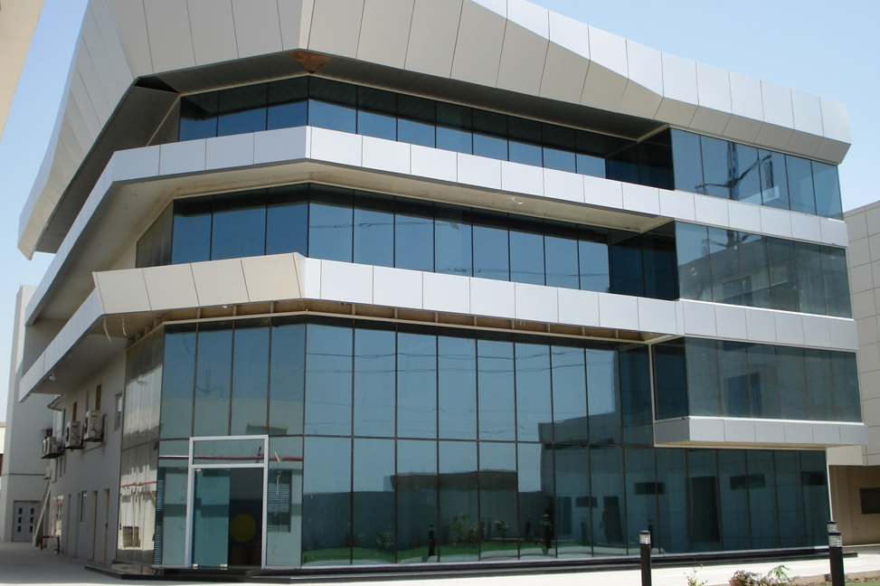 Modern building featuring energy-efficient architectural glass panels.