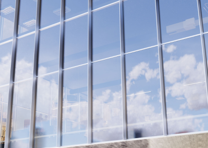 Modern building featuring energy-efficient architectural glass panels for reduced energy use.