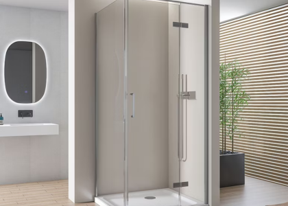 Modern glass cabin maximizing space in a compact bathroom.