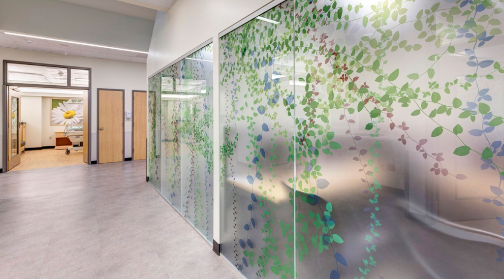 Transparent LED digital glass wall creating a modern, dynamic corporate lobby in Pakistan