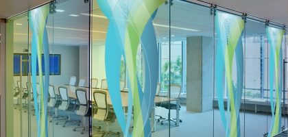 Transparent digital glass wall with LED display creating a modern corporate lobby experience in Pakistan