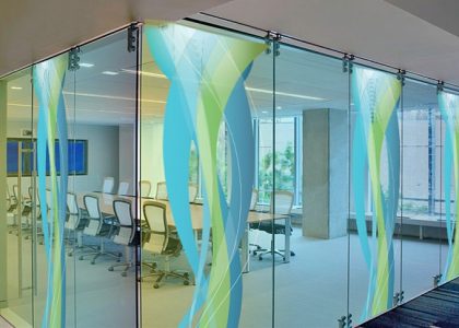 Transparent digital glass wall with LED display creating a modern corporate lobby experience in Pakistan