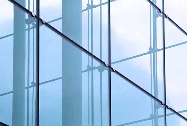 Modern frameless glass façade with point-supported glass fixing technology.